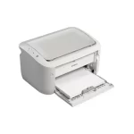 Canon LBP6030B printer placed on a desk in a small work environment
