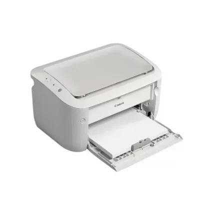 Canon LBP6030B printer placed on a desk in a small work environment